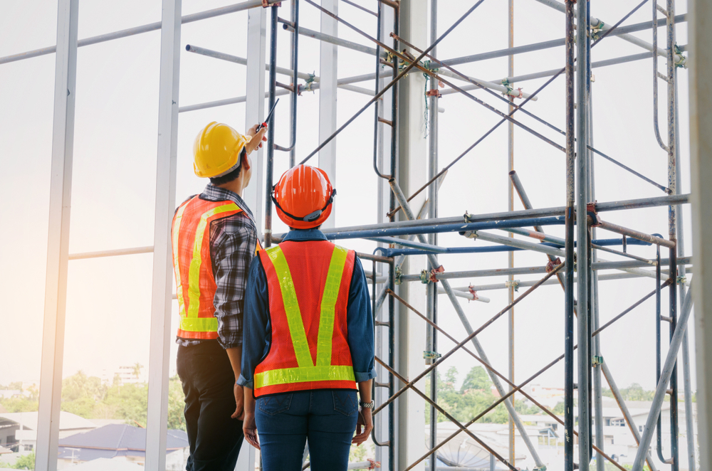 Couple,Of,Engineer,Or,Technician,Man,And,Woman,With,Safety